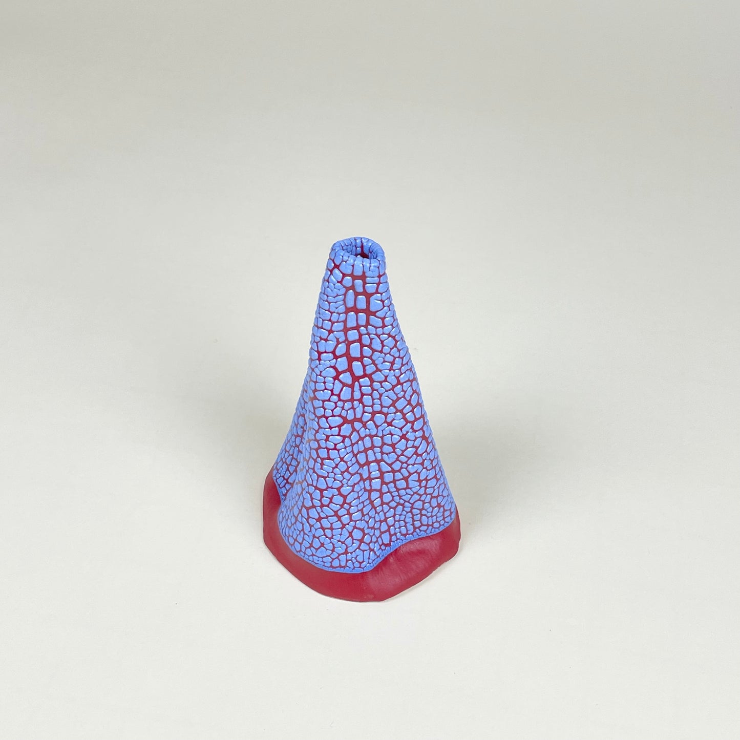 Red and blue volcano vase (L) by Astrid Öhman.