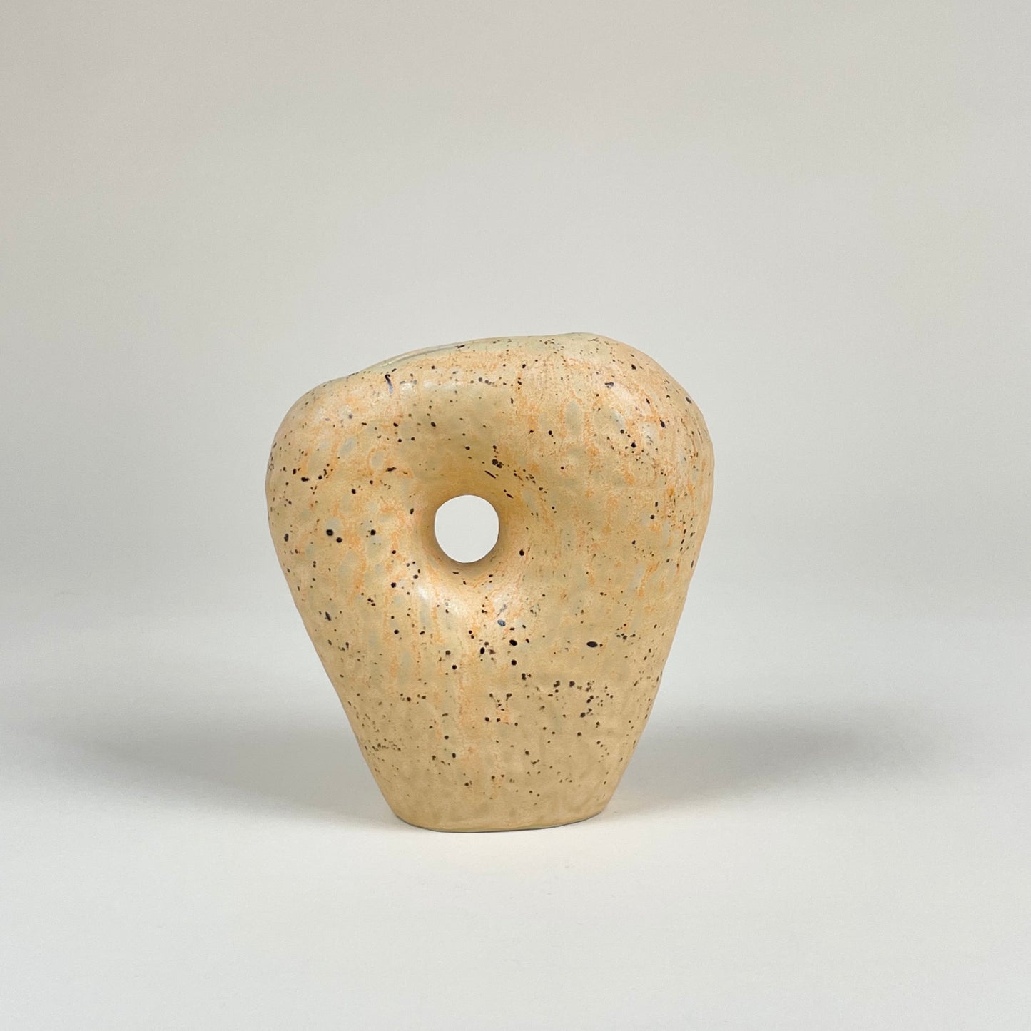 Orange ceramic vase with black speckles by Malwina Kleparska