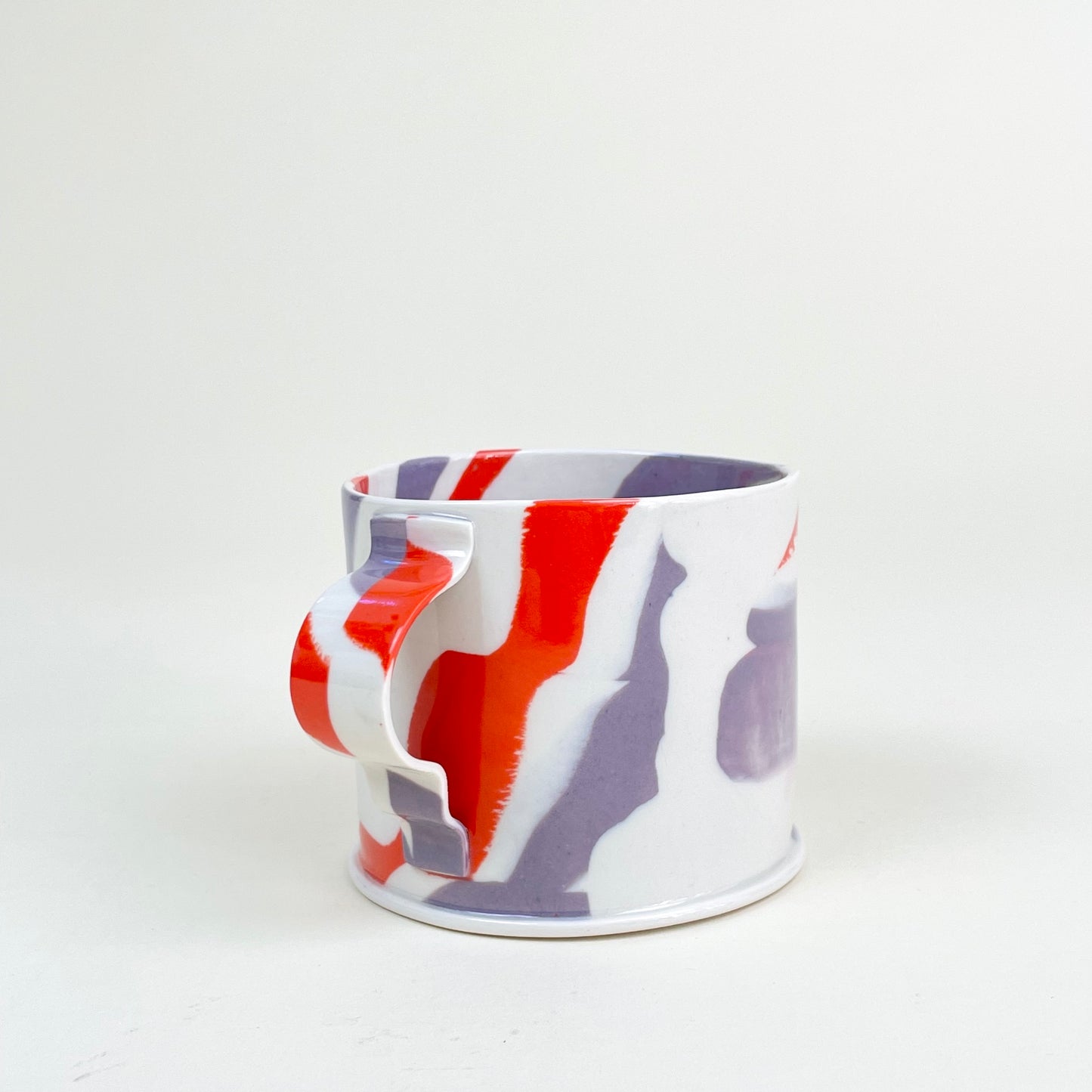 Ceramic mug by Emma Berzén (cream red purple)