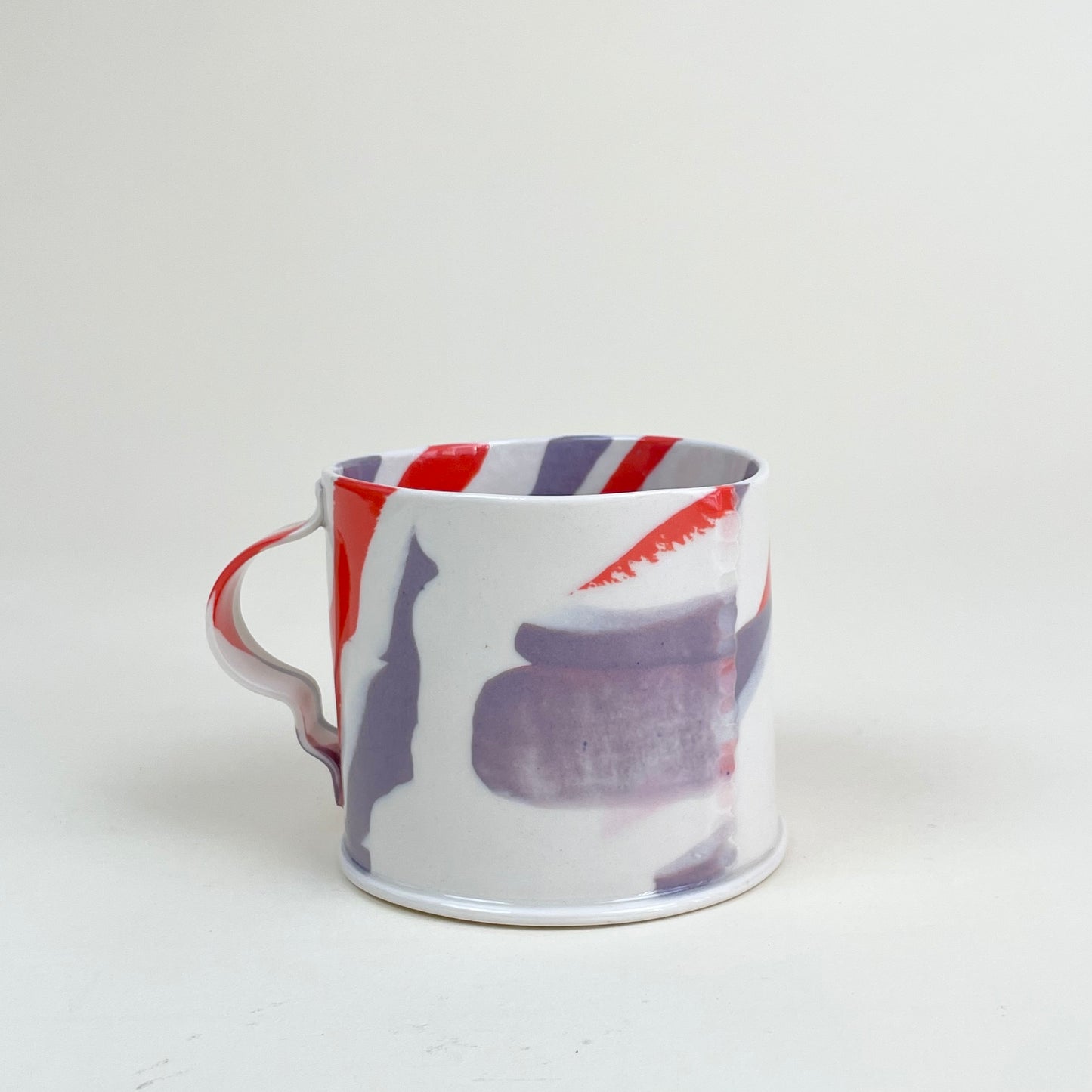 Ceramic mug by Emma Berzén (cream red purple)