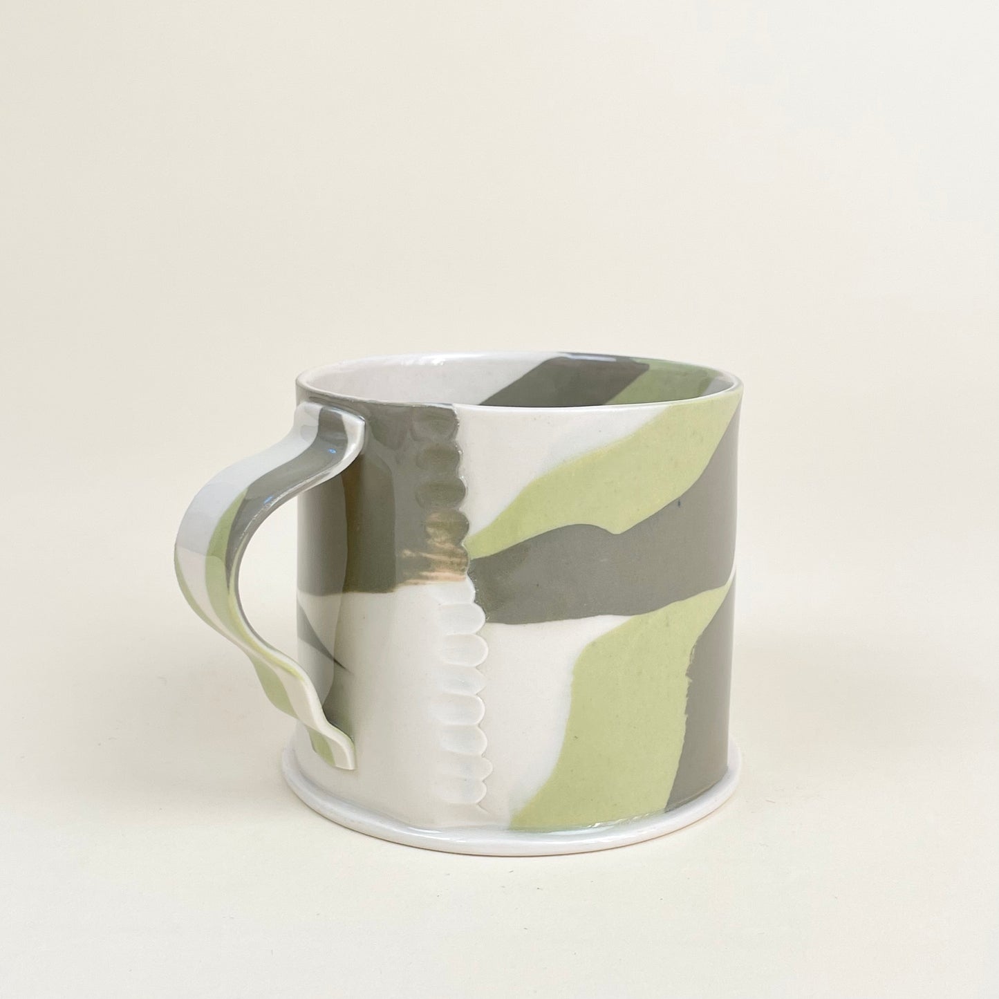 Ceramic mug by Emma Berzén (cream and greens)