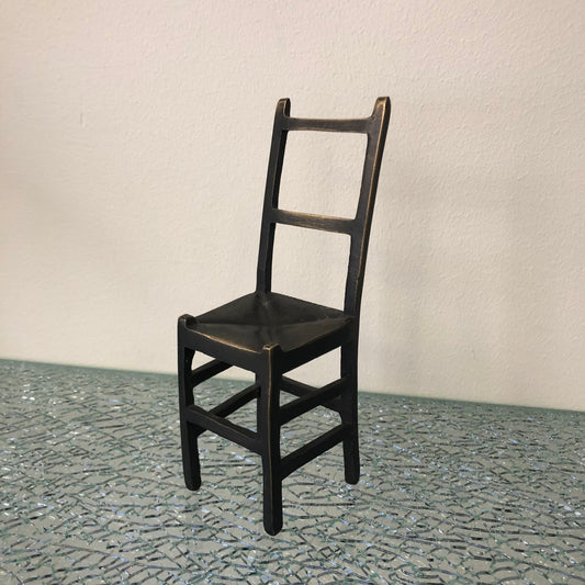 Miniature bronze chair